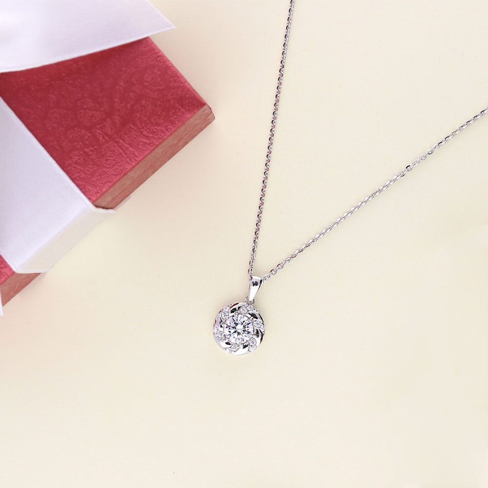 Flatlay view of Woven Wreath CZ Necklace and Earrings Set in Sterling Silver