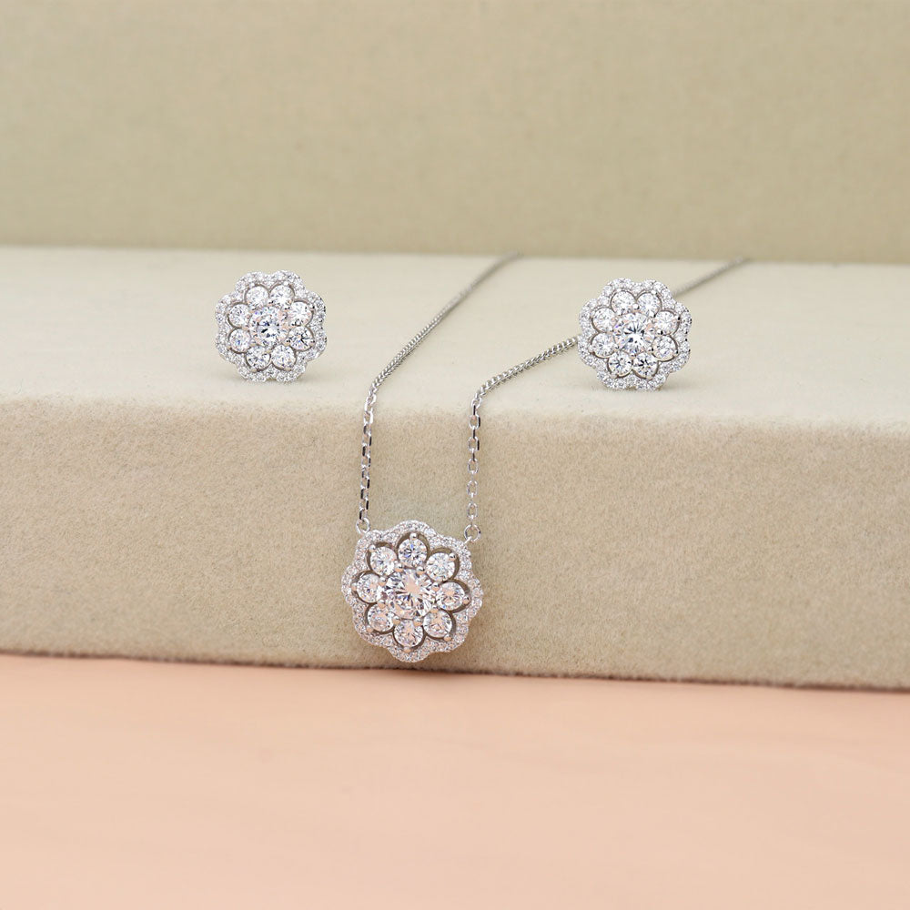 Flatlay view of Flower Halo CZ Stud Earrings in Sterling Silver