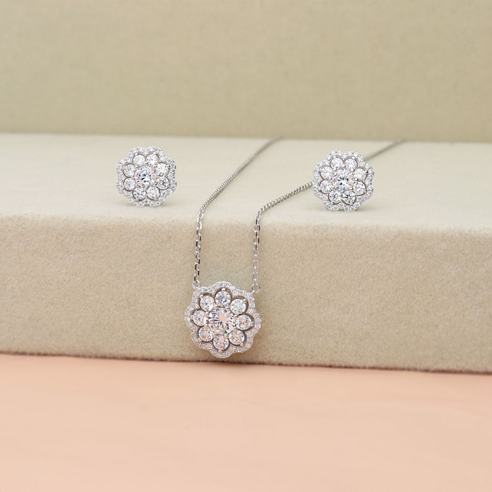 Flatlay view of Flower Halo CZ Necklace and Earrings Set in Sterling Silver, 7 of 14