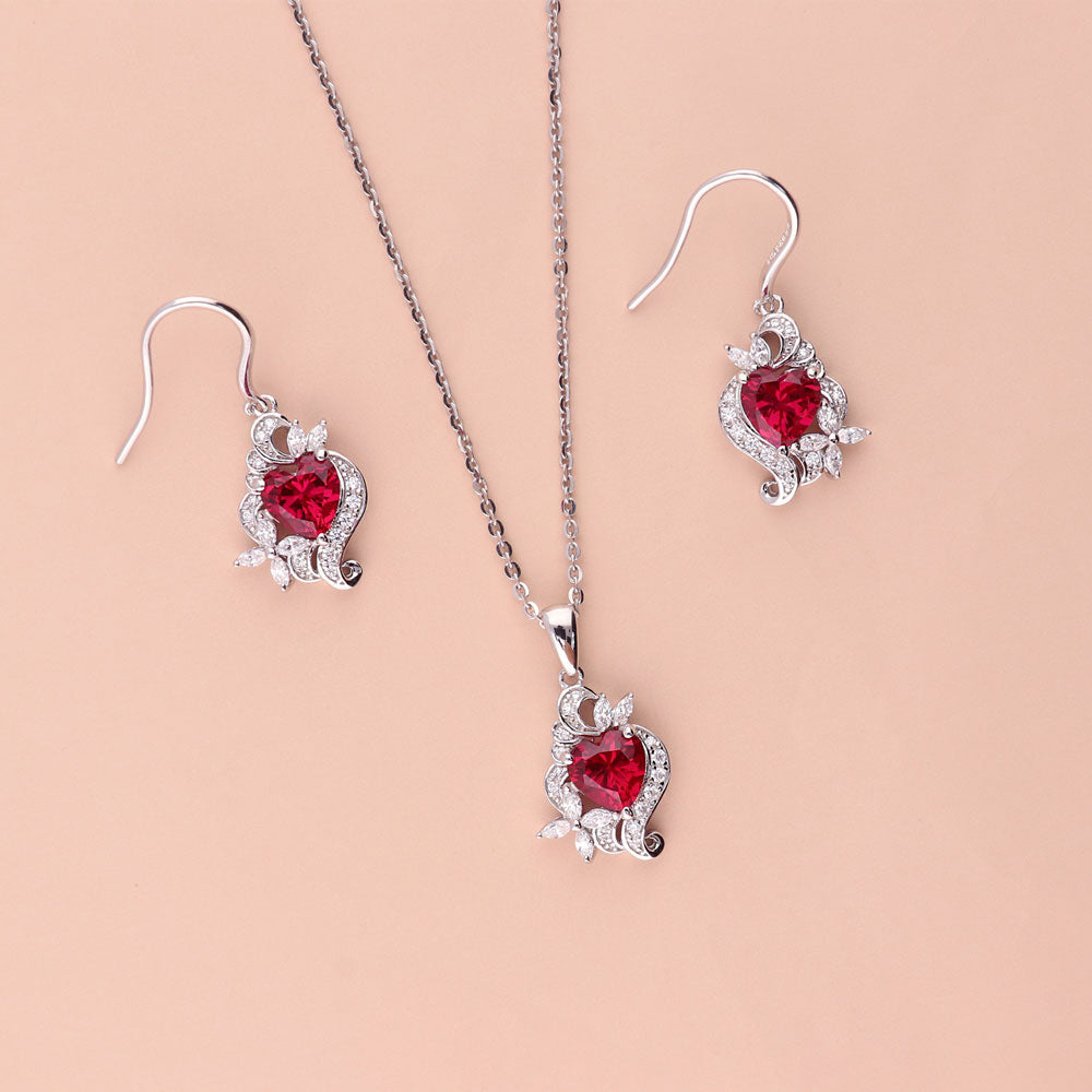 Flatlay view of Flower Heart Simulated Ruby CZ Set in Sterling Silver