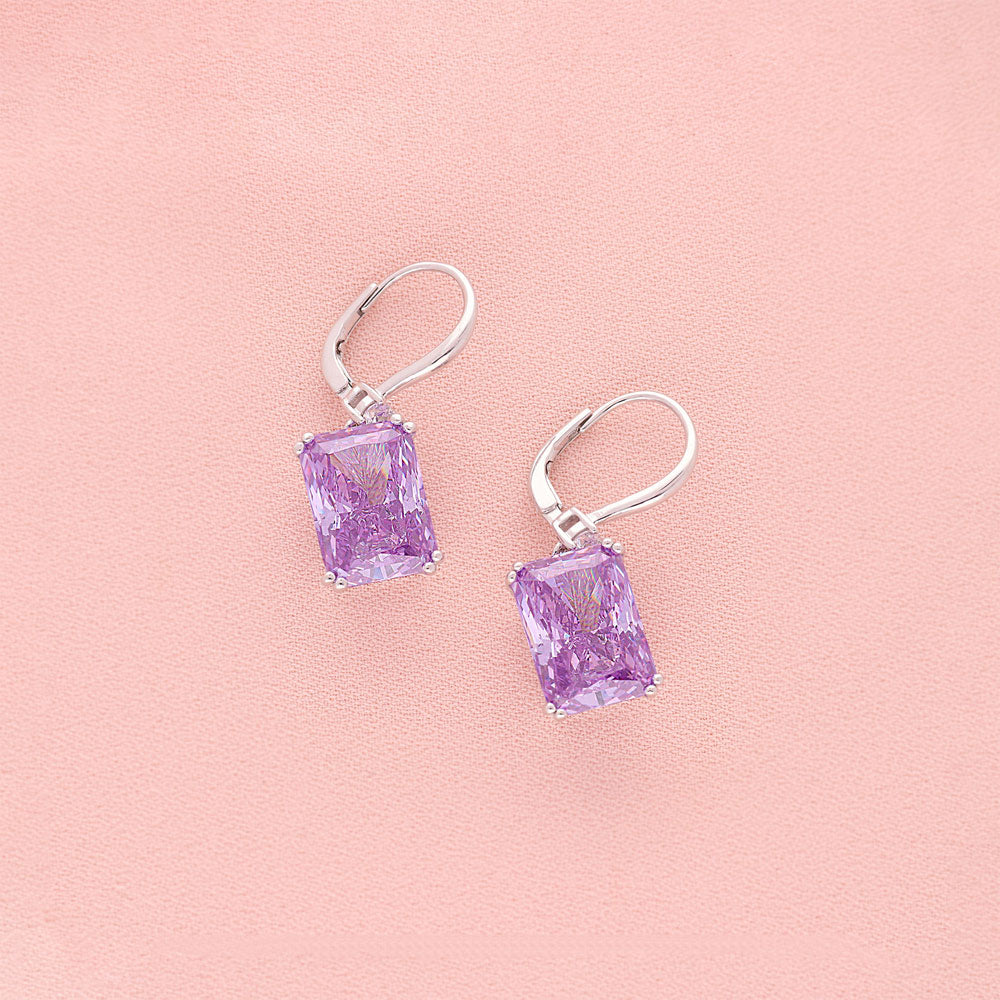 Flatlay view of Solitaire Purple Radiant CZ Leverback Earrings in Sterling Silver 17ct