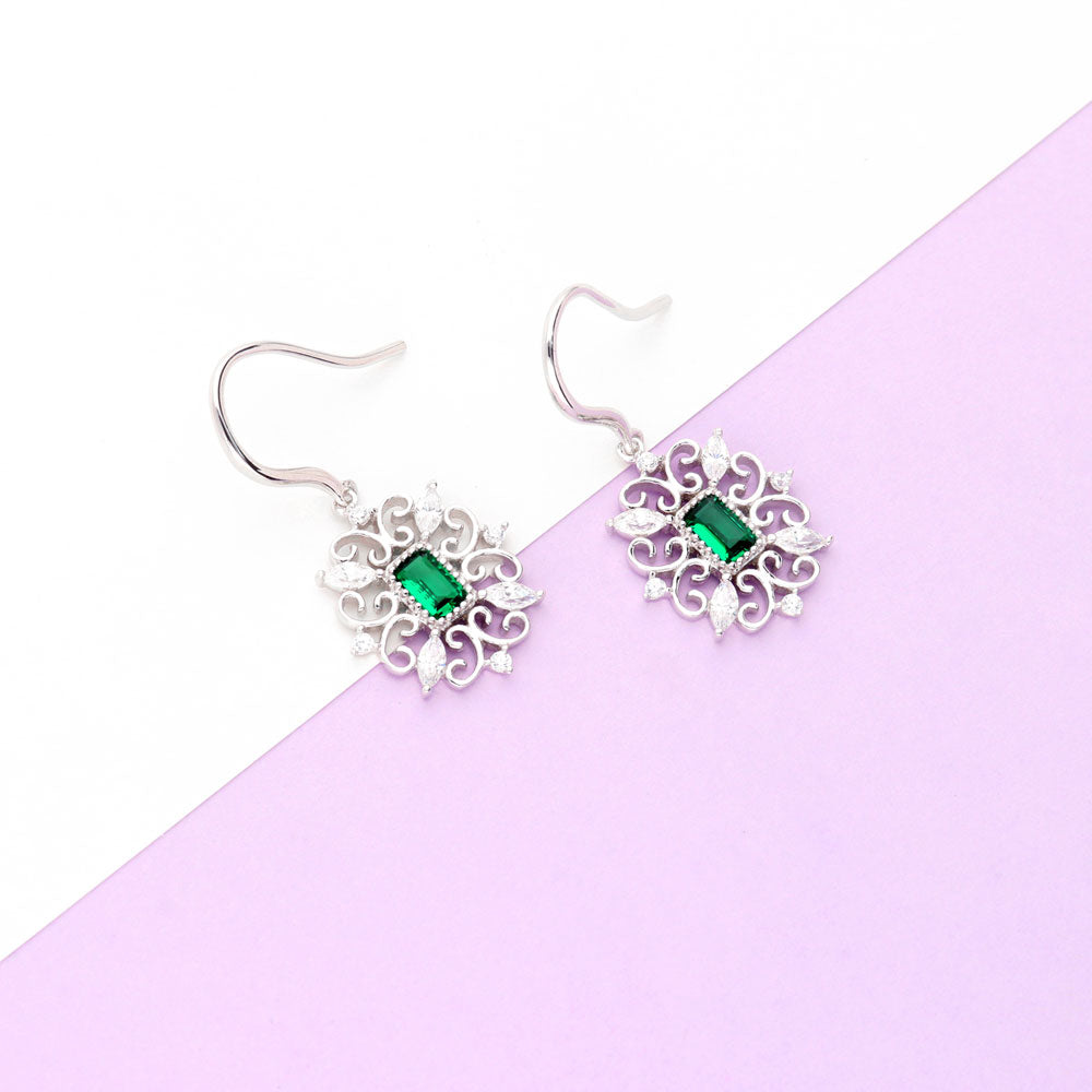 Flatlay view of Art Deco Filigree Green CZ Fish Hook Dangle Earrings in Sterling Silver