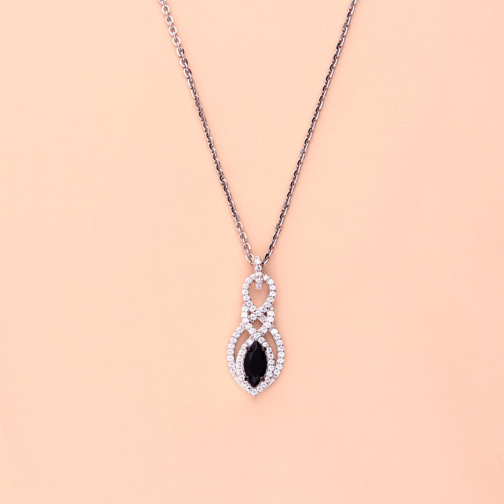 Flatlay view of Black and White Woven CZ Pendant Necklace in Sterling Silver