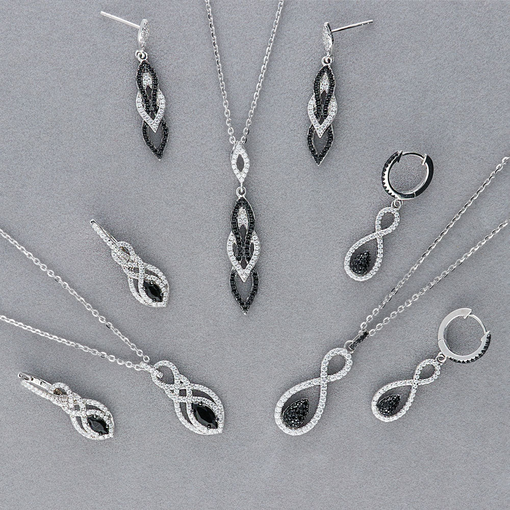Flatlay view of Black and White CZ Necklace and Earrings Set in Sterling Silver