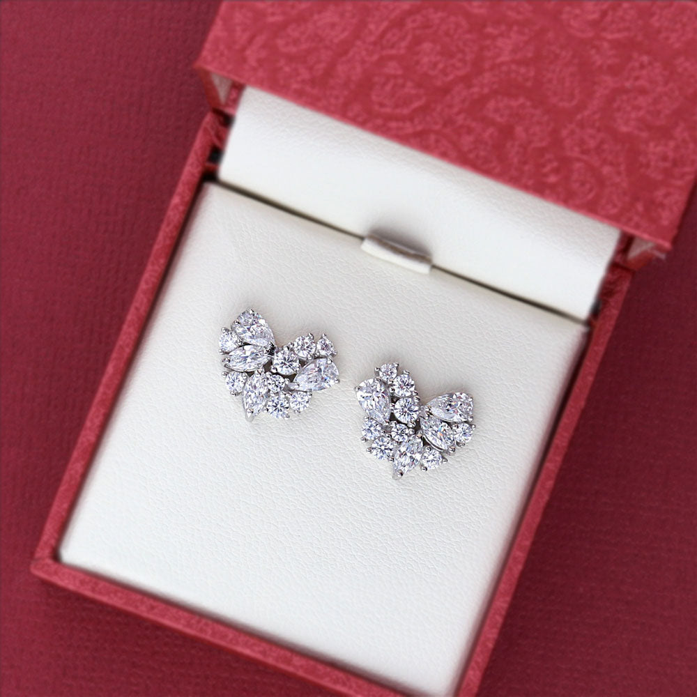 Flatlay view of Cluster Heart CZ Stud Earrings in Sterling Silver