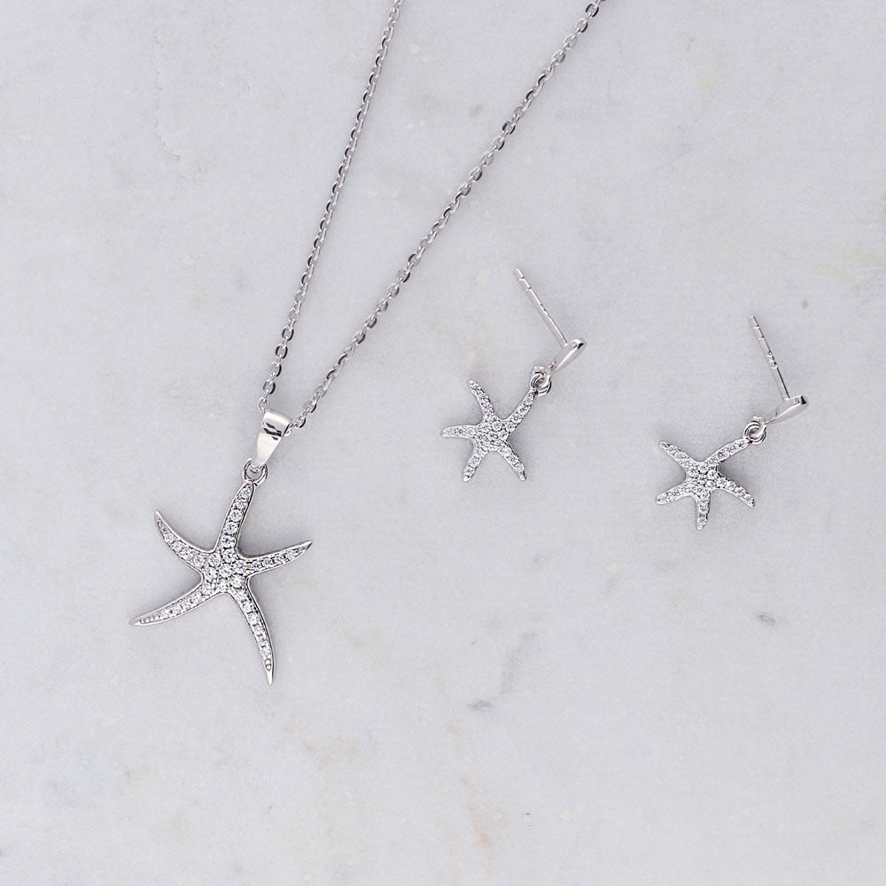 Flatlay view of Starfish CZ Dangle Earrings in Sterling Silver