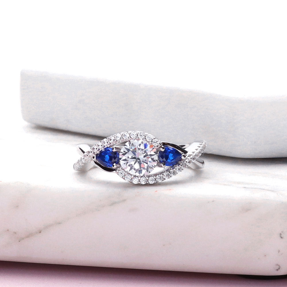 Flatlay view of 3-Stone Woven Round CZ Ring in Sterling Silver