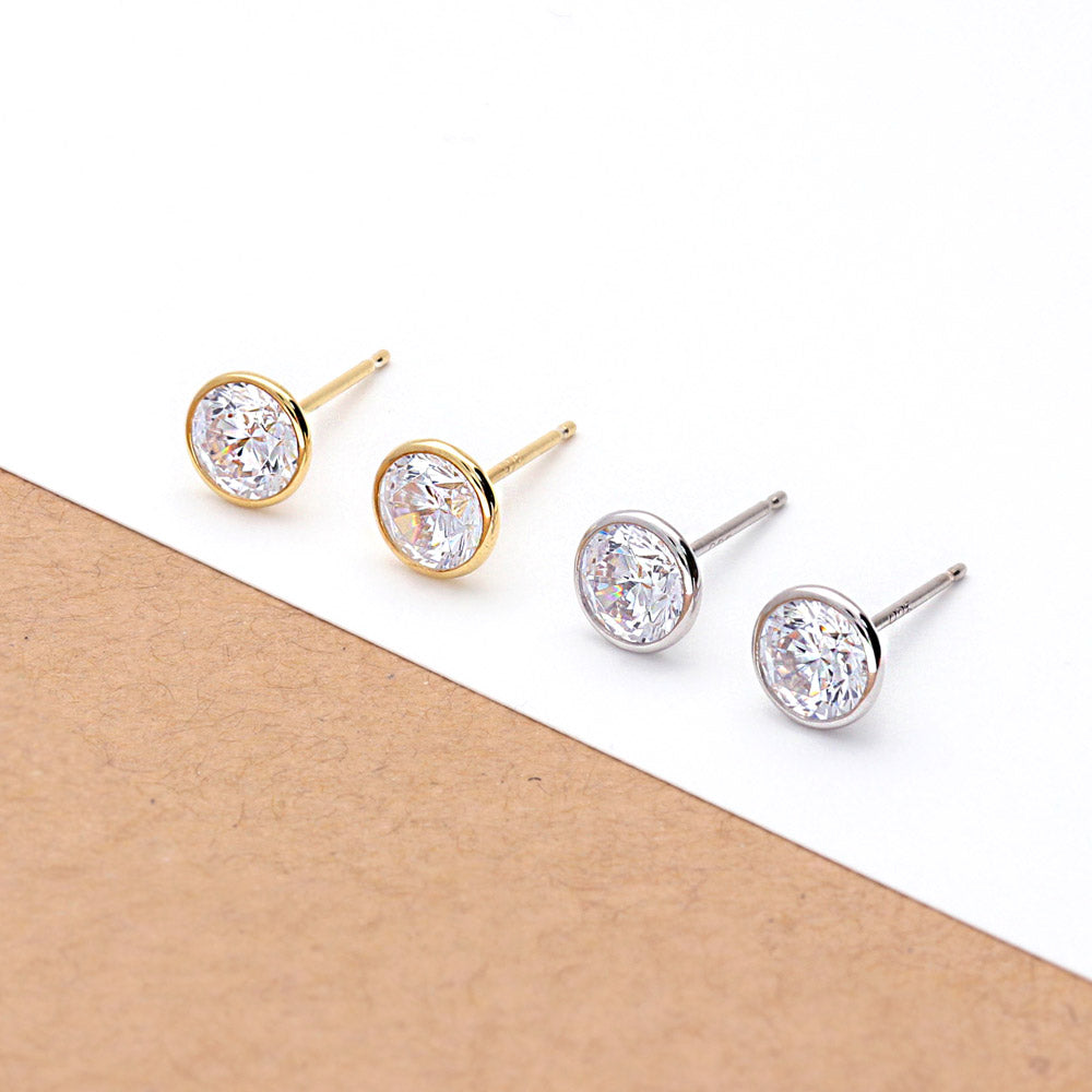 Flatlay view of Solitaire Bezel Set Round CZ Stud Earrings in Sterling Silver