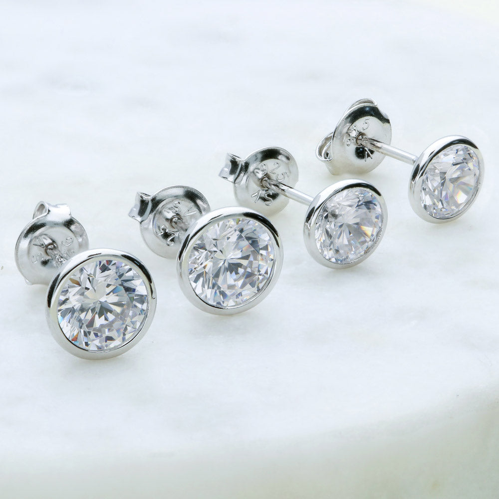 Flatlay view of Solitaire Bezel Set Round CZ Stud Earrings in Sterling Silver
