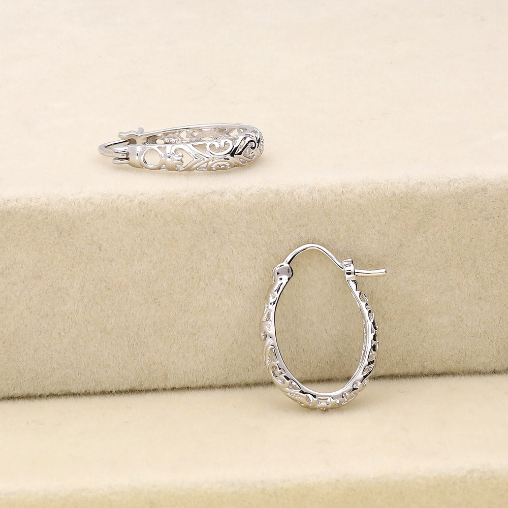 Flatlay view of Oval Filigree Medium Hoop Earrings in Sterling Silver 0.77 inch