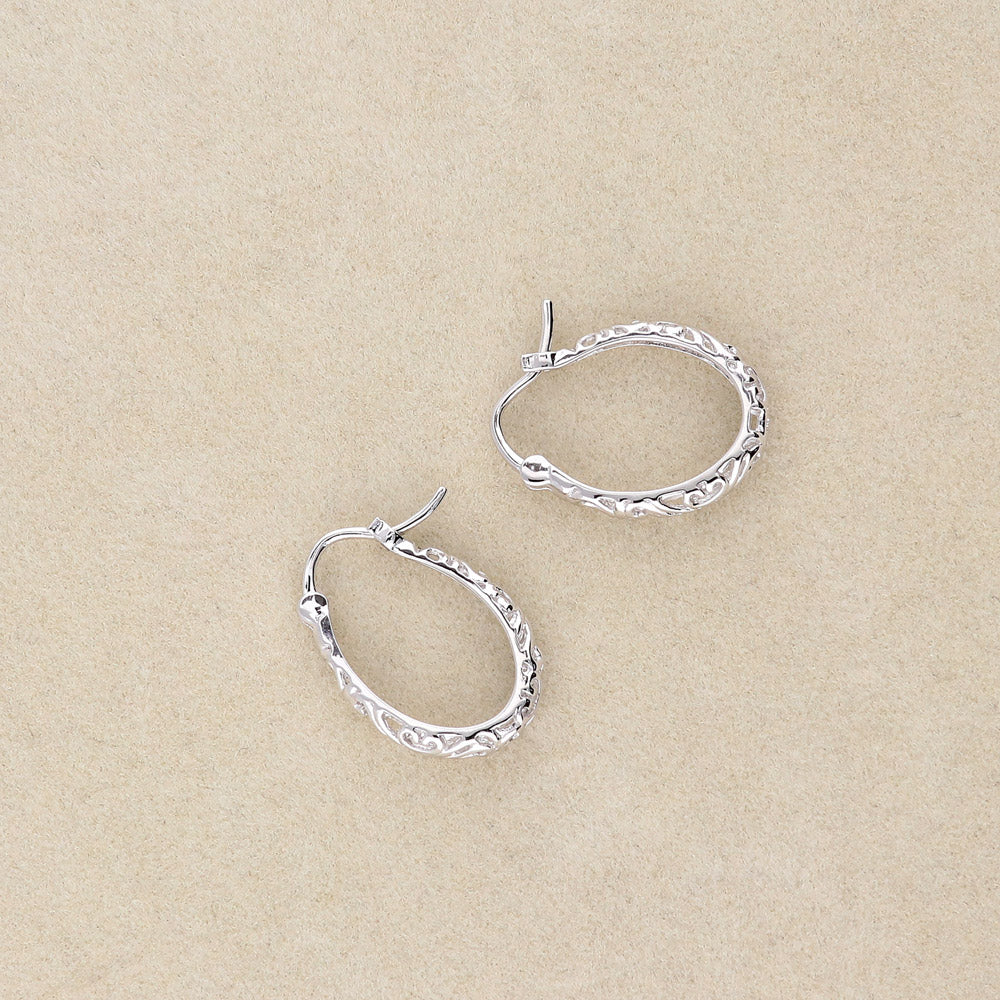 Flatlay view of Oval Filigree Medium Hoop Earrings in Sterling Silver 0.77 inch