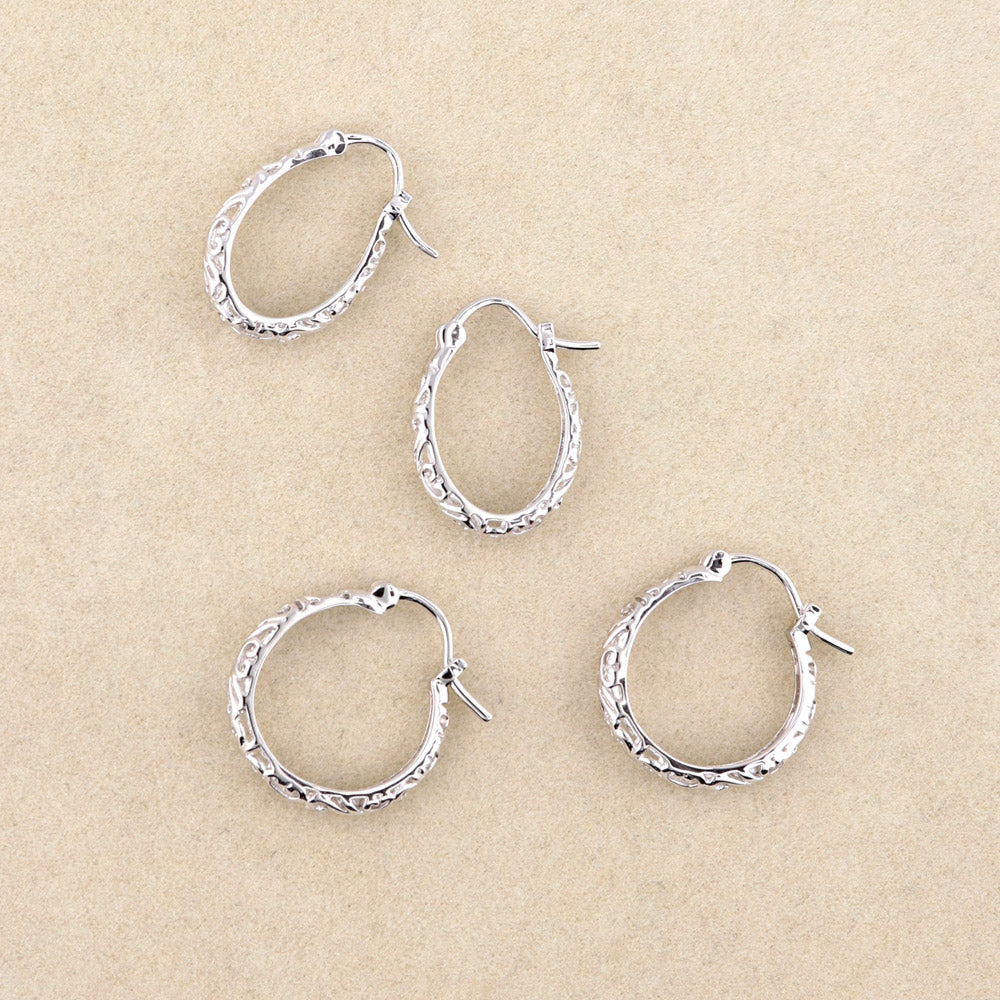 Flatlay view of Oval Filigree Medium Hoop Earrings in Sterling Silver 0.77 inch