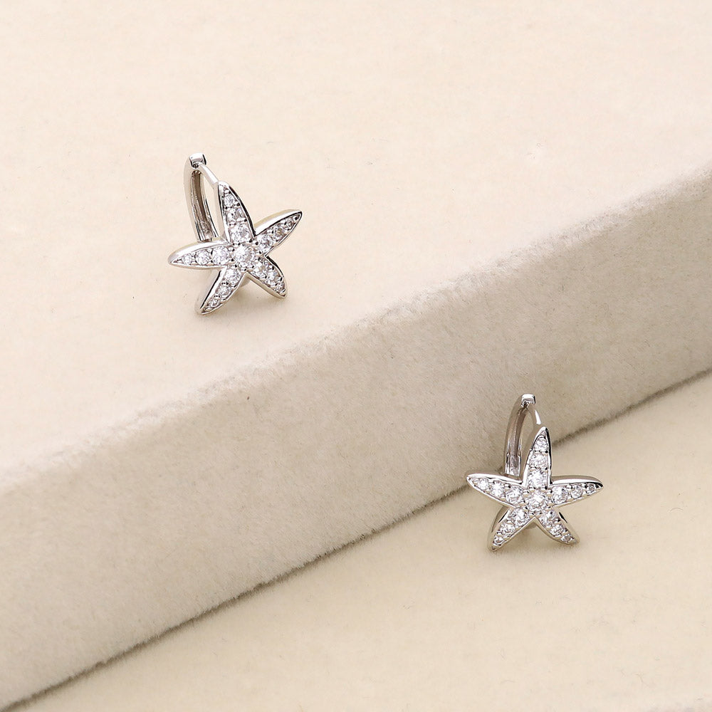 Flatlay view of Starfish CZ Small Huggie Earrings in Sterling Silver 0.5 inch