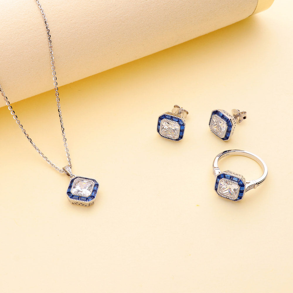 Flatlay view of Halo Art Deco Princess CZ Necklace and Earrings Set in Sterling Silver