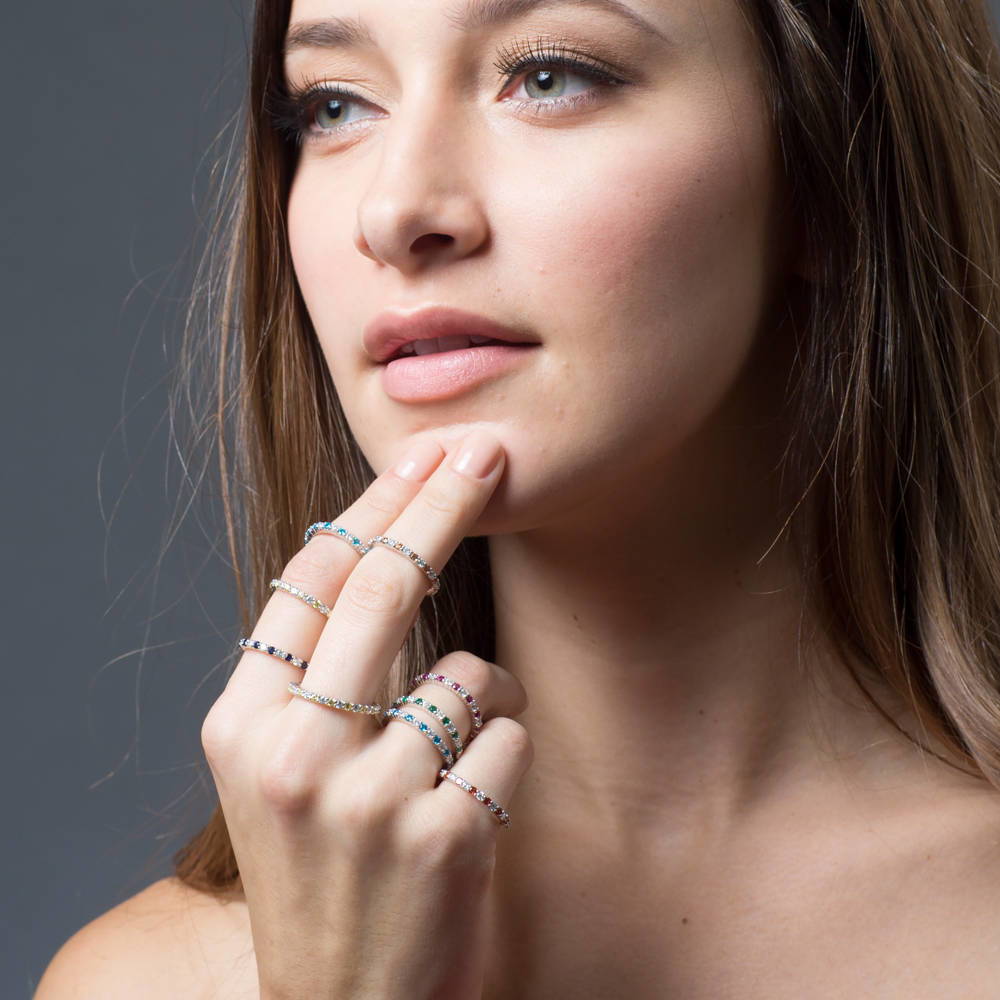 Model wearing Simulated Ruby Pave Set CZ Stackable Eternity Ring in Sterling Silver