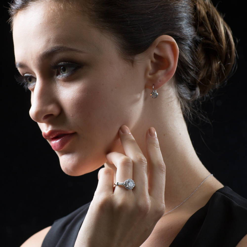 Model wearing Halo Round CZ Leverback Dangle Earrings in Sterling Silver, 2 Pairs