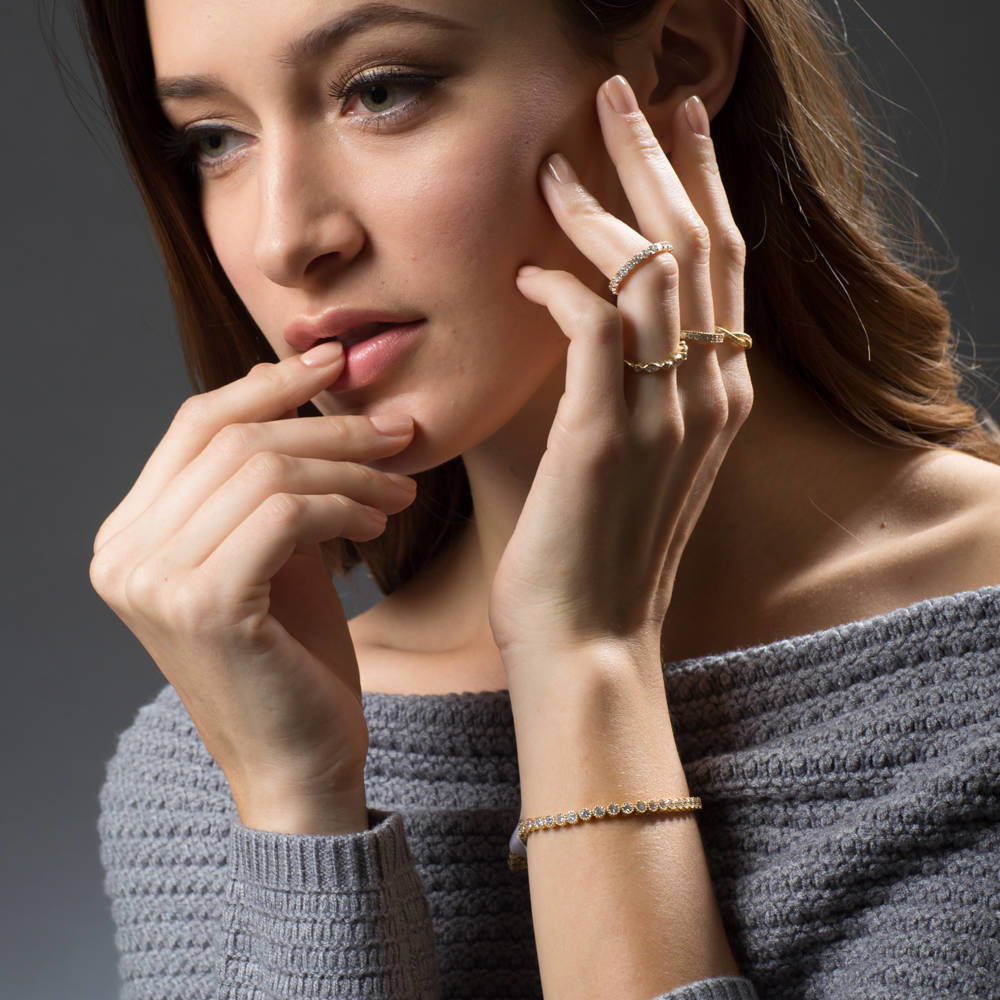 Model wearing Pave Set CZ Eternity Ring in Gold Flashed Sterling Silver