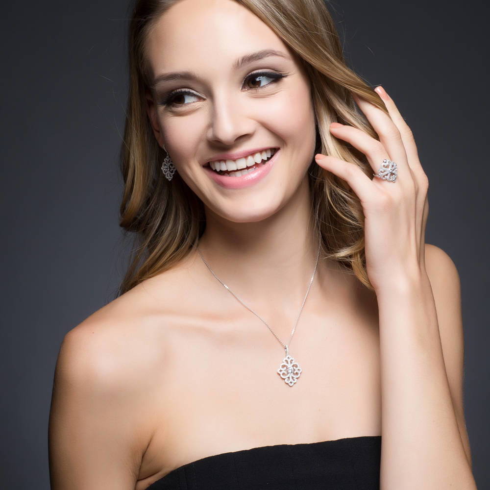 Model wearing Art Deco Filigree CZ Dangle Earrings in Sterling Silver