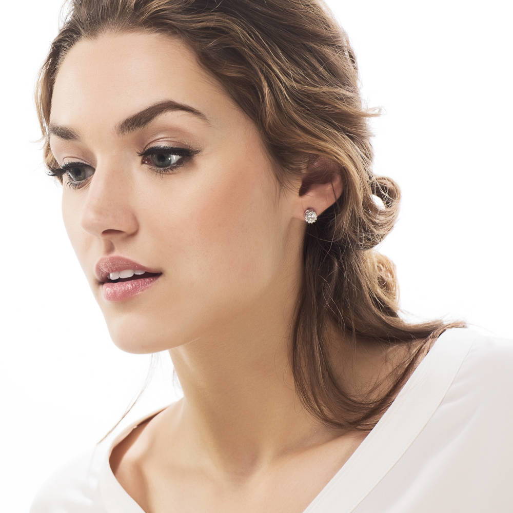 Model wearing Solitaire 1.6ct Crown Set Round CZ Stud Earrings in Sterling Silver