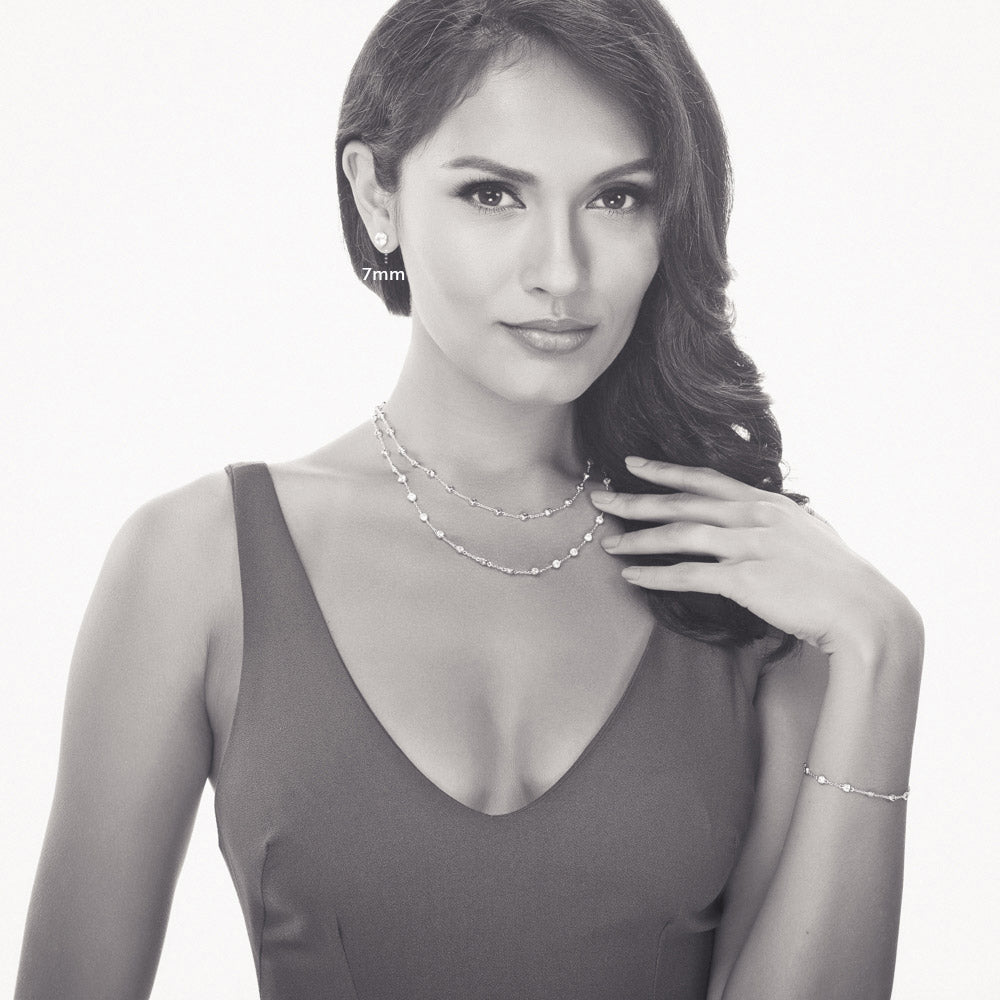 Model wearing Solitaire Bezel CZ Stud Earrings in Sterling Silver, 4mm