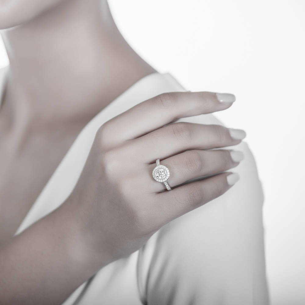 Model wearing Halo Round CZ Statement Ring Set in Sterling Silver