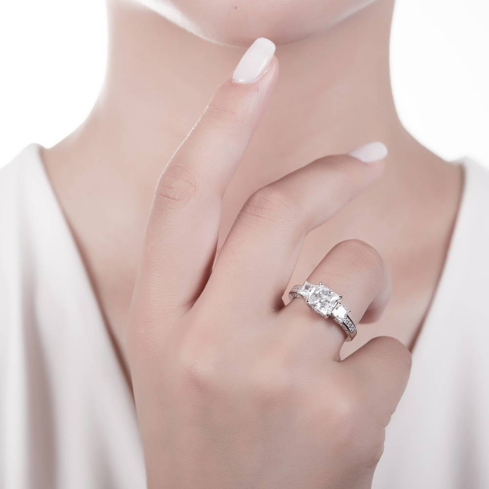 Model wearing 3-Stone Princess CZ Ring in Sterling Silver