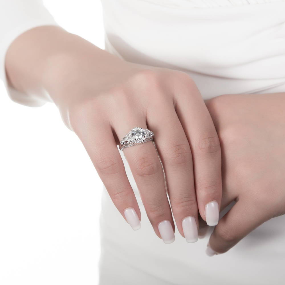 Model wearing Halo Art Deco Round CZ Ring in Sterling Silver