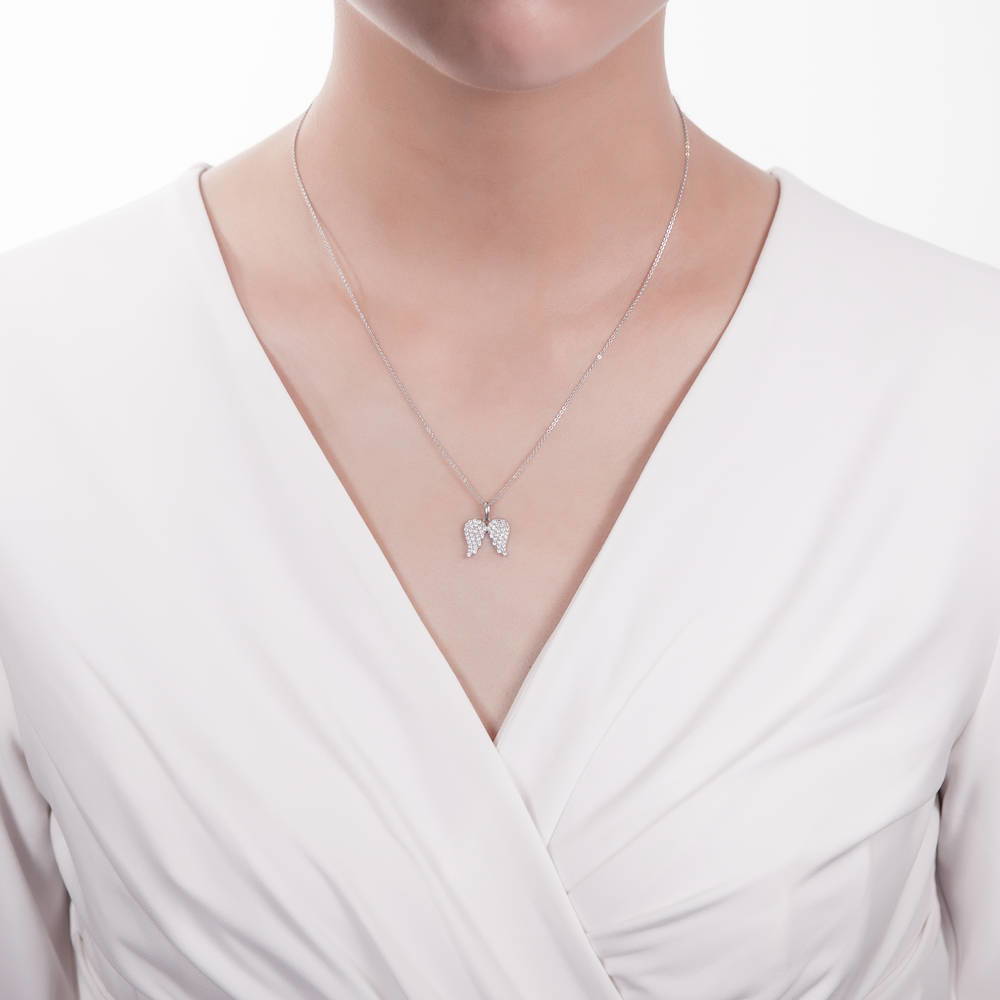 Model wearing Angel Wings CZ Pendant Necklace in Sterling Silver
