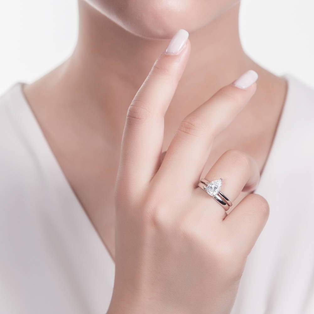 Model wearing Solitaire 1.8ct Pear CZ Ring Set in Sterling Silver