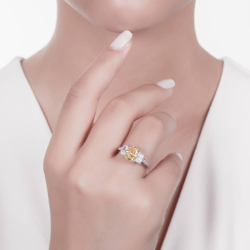 Model wearing 3-Stone Canary Yellow Cushion CZ Ring in Sterling Silver