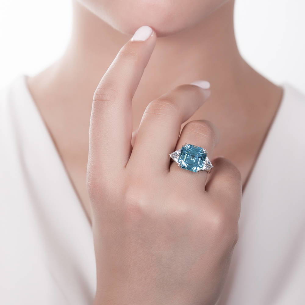 Model wearing 3-Stone Blue Asscher CZ Statement Ring in Sterling Silver