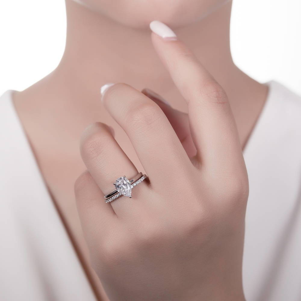 Model wearing Solitaire 1.8ct Pear CZ Ring Set in Sterling Silver, 2 of 15