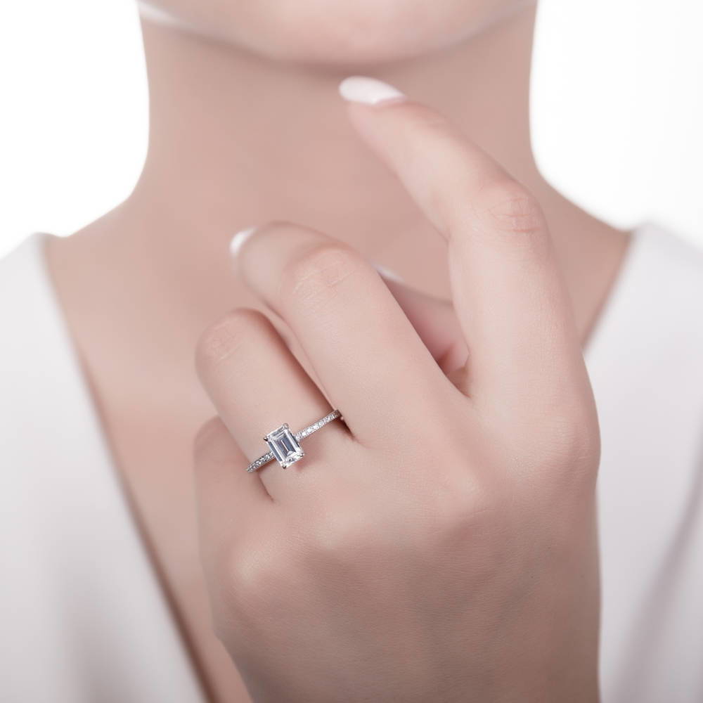 Model wearing Solitaire 1ct Emerald Cut CZ Ring in Sterling Silver