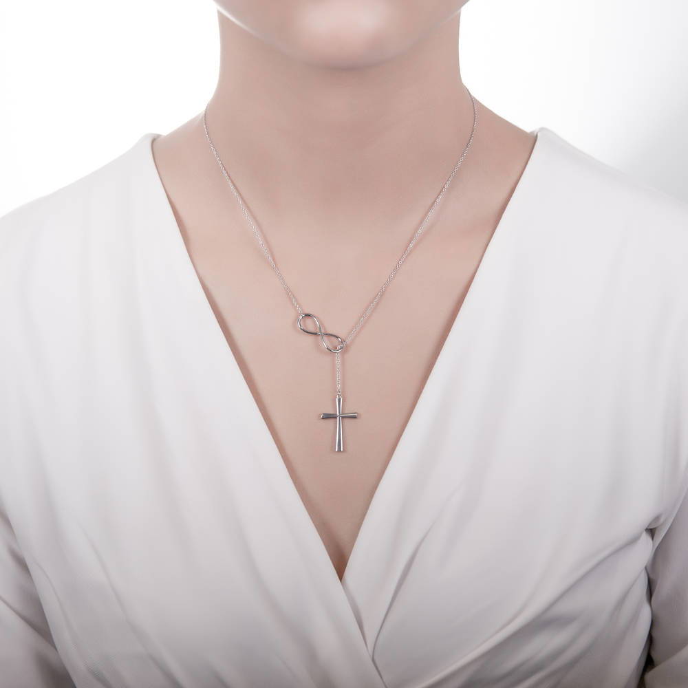 Model wearing Infinity Cross Lariat Necklace in Sterling Silver