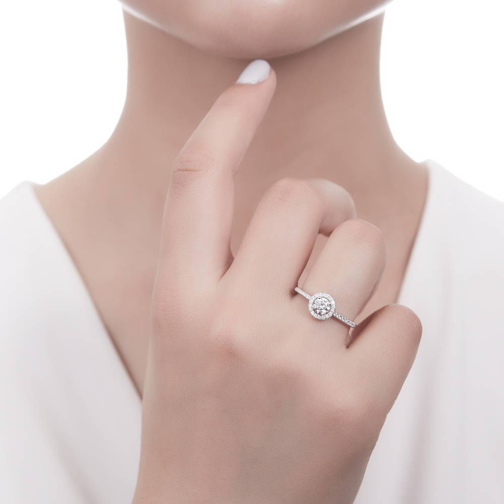 Model wearing Halo Round CZ Ring in Sterling Silver