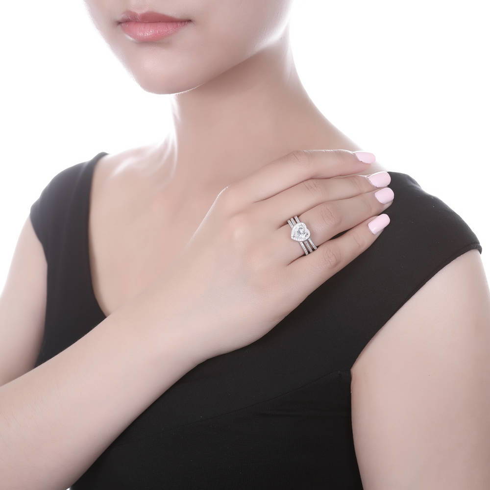 Model wearing Halo Heart CZ Ring Set in Sterling Silver