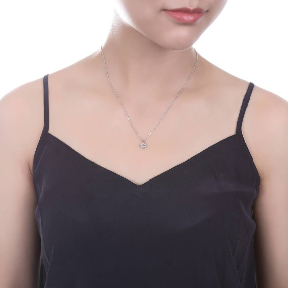Model wearing Solitaire 0.6ct Bezel Set Cushion CZ Necklace in Sterling Silver, 3 of 6