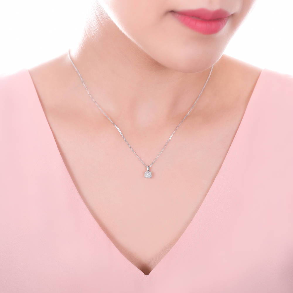 Model wearing Solitaire 0.6ct Bezel Set Cushion CZ Necklace in Sterling Silver, 2 of 6