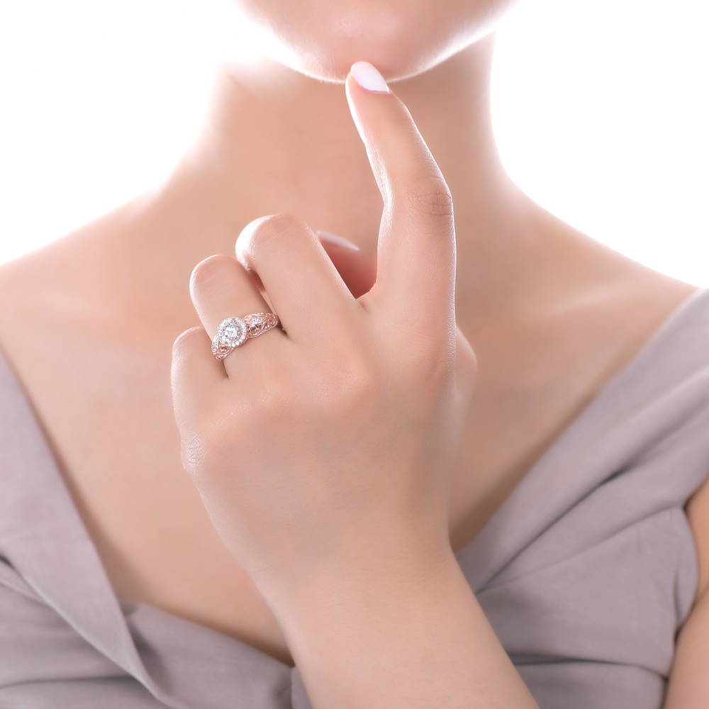 Model wearing Halo Art Deco Round CZ Ring in Rose Gold Plated Sterling Silver