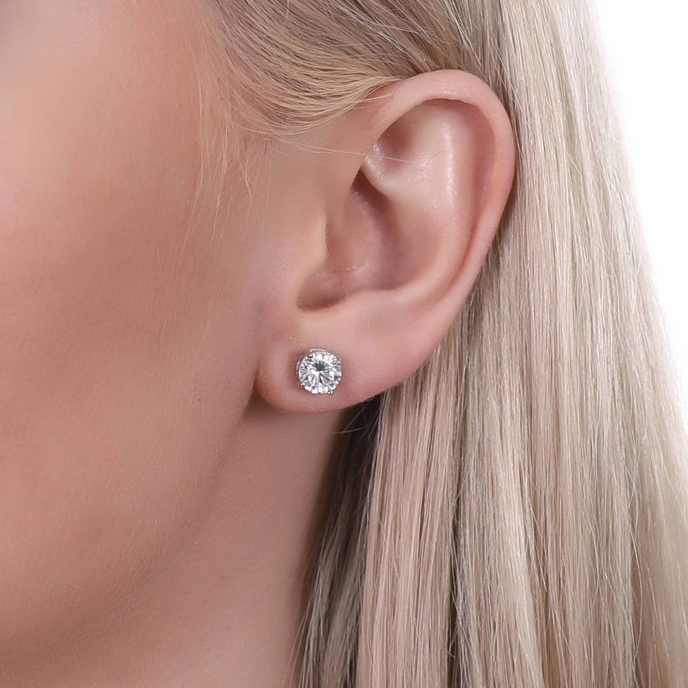 Model wearing Solitaire 2ct Round CZ Stud Earrings in Sterling Silver