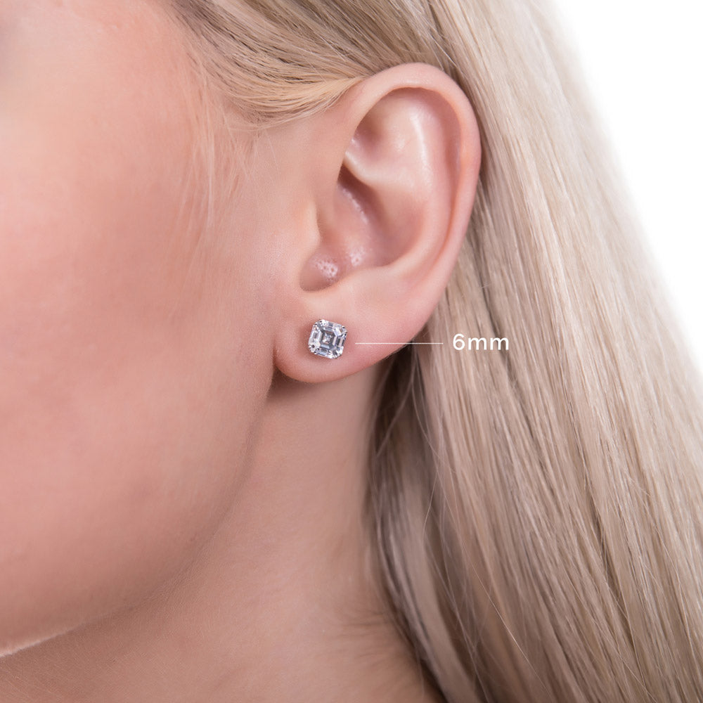 Model wearing Solitaire Asscher CZ Stud Earrings in Sterling Silver