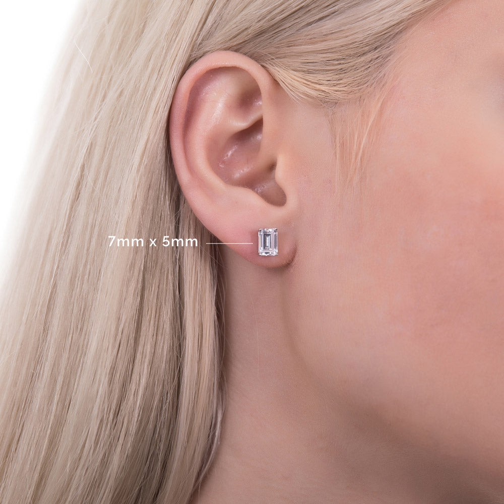 Model wearing Solitaire Emerald Cut CZ Stud Earrings in Sterling Silver