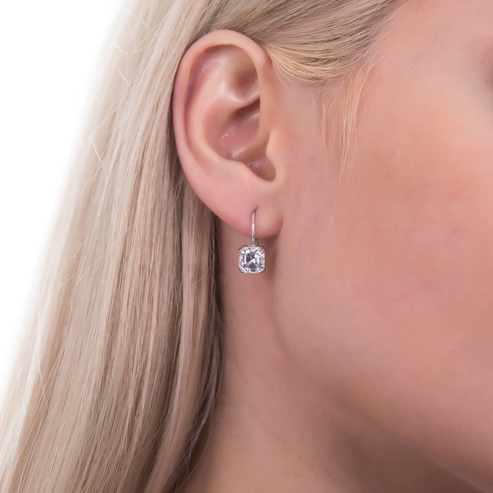 Model wearing Solitaire 4ct Asscher CZ Leverback Dangle Earrings in Sterling Silver