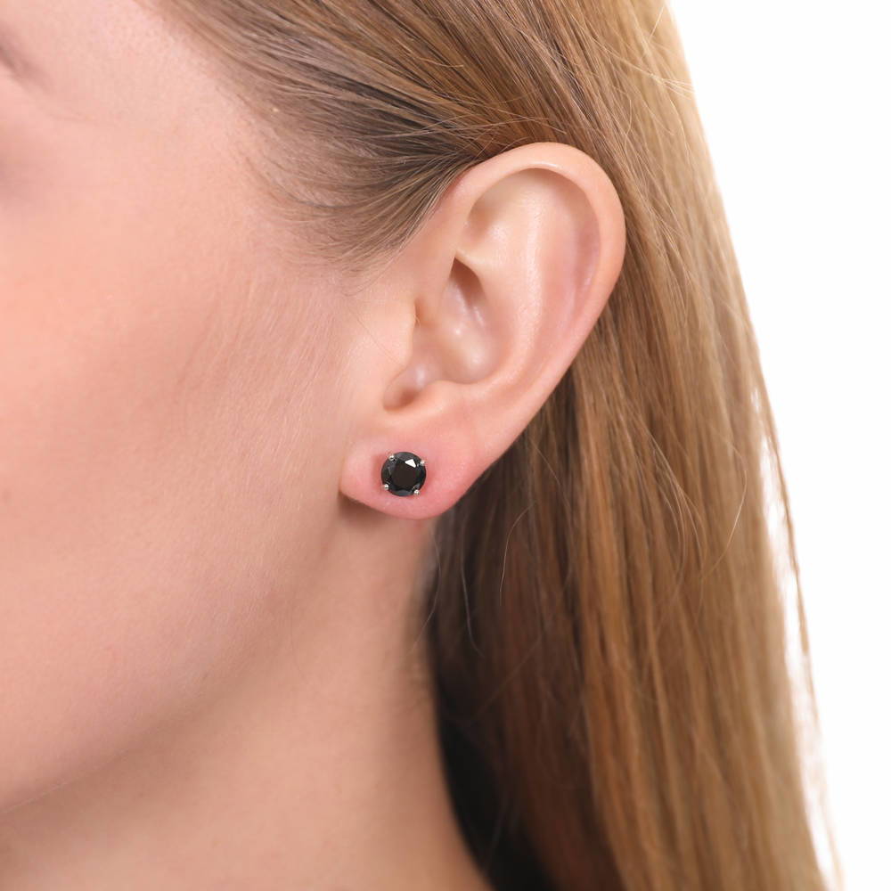 Model wearing Solitaire Black Round CZ Stud Earrings in Sterling Silver 2.5ct