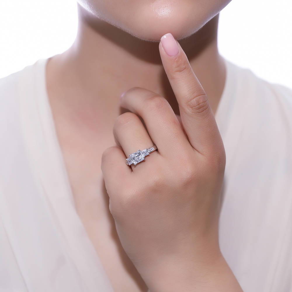 Model wearing 3-Stone Princess CZ Ring in Sterling Silver