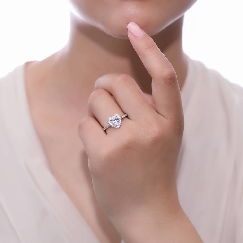 Model wearing Halo Heart CZ Ring in Sterling Silver