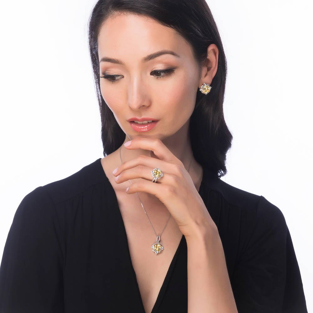 Model wearing Halo Canary Cushion CZ Omega Back Stud Earrings in Sterling Silver