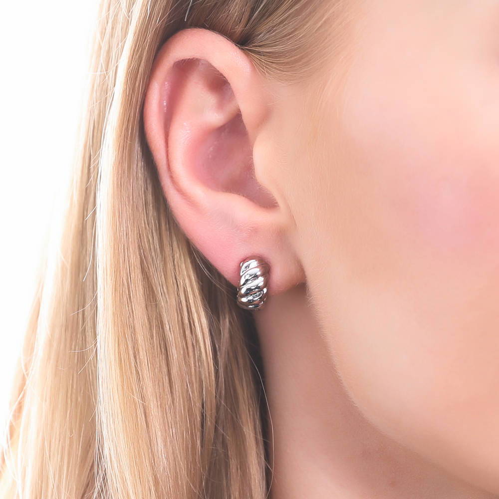 Model wearing Cable Small Huggie Earrings in Sterling Silver 0.5 inch