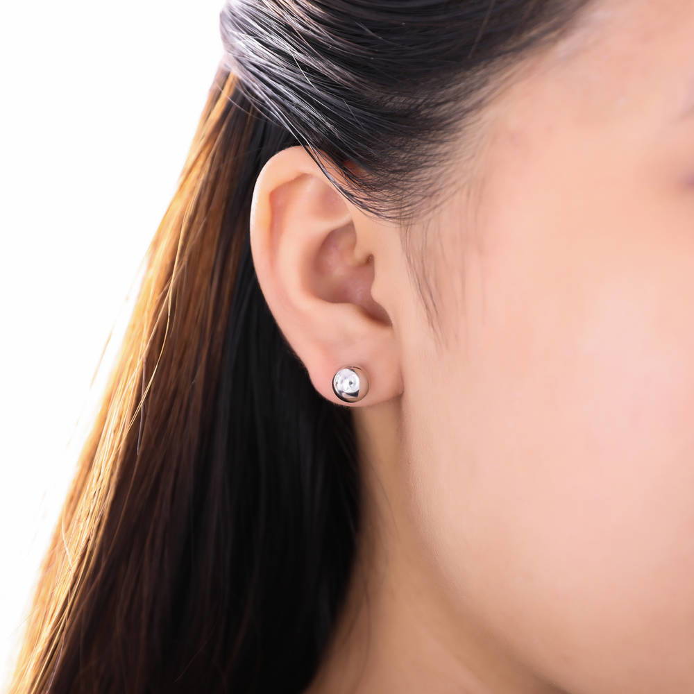 Model wearing Ball Bead Stud Earrings in Sterling Silver