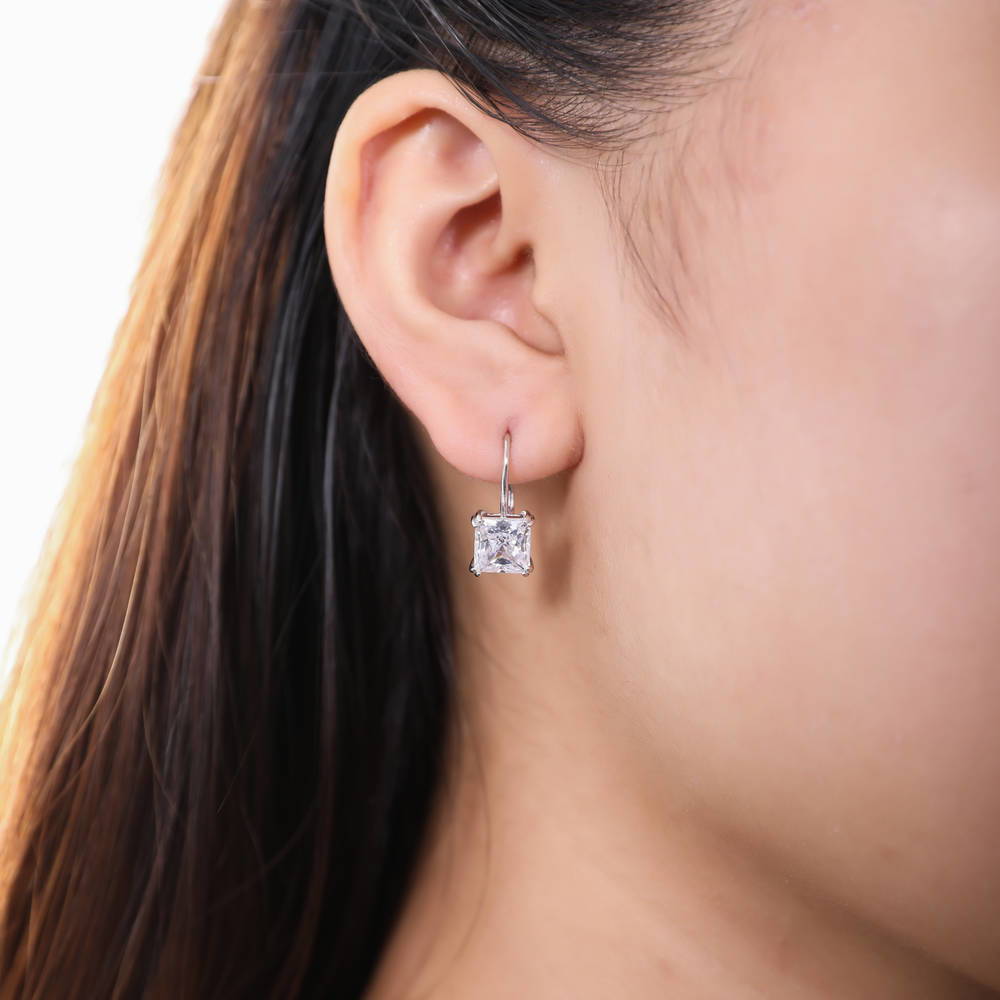 Model wearing Solitaire 4ct Princess CZ Leverback Dangle Earrings in Sterling Silver